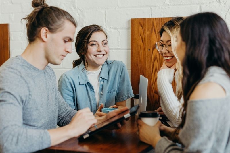 Students discussing at a table